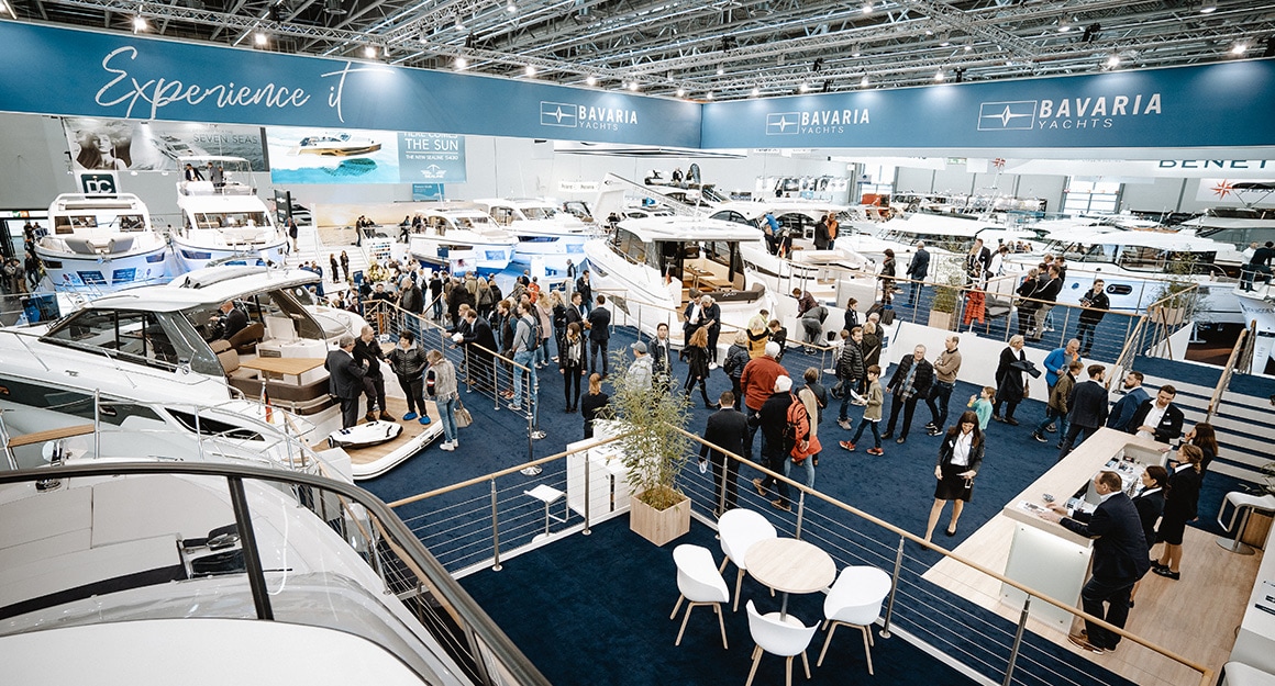 View from above of the boot exhibition hall with numerous yachts and visitors.