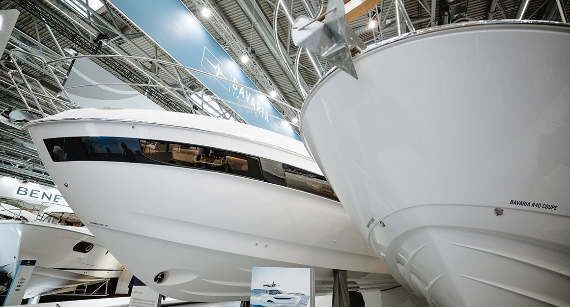 The bows of two motorboats from the frog's perspective.
