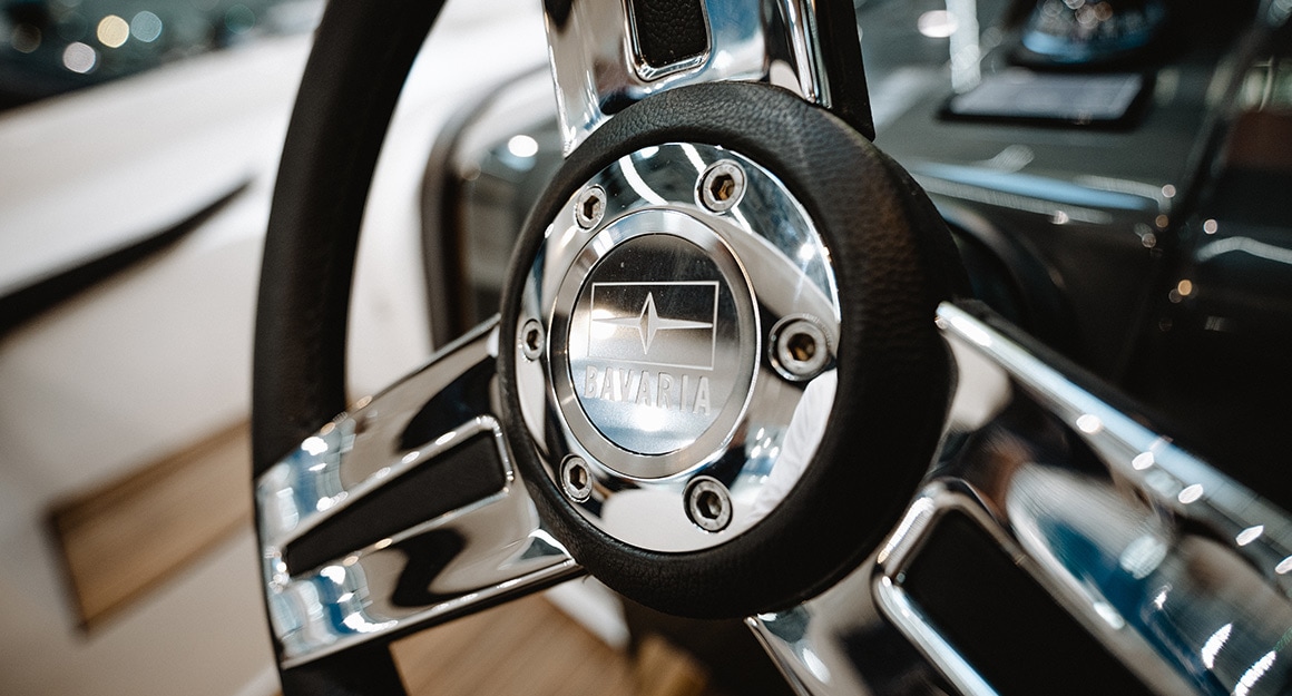 Close-up of the steering wheel of a BAVARIA YACHT.
