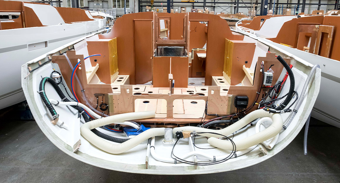 View of hull with numerous installations, next to further hulls.