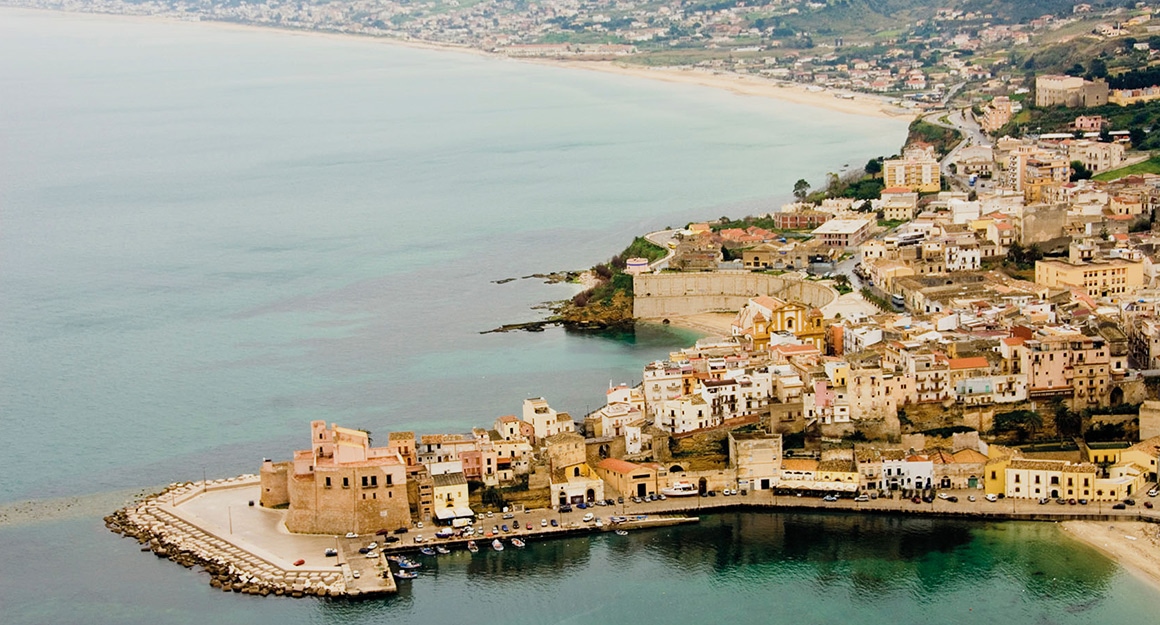 Long coastal town from a bird's eye view.