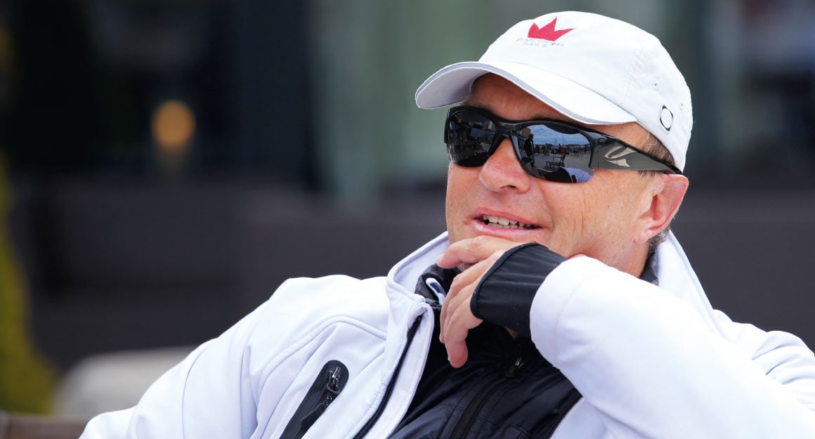 A man with sunglasses, a white cap and a white jacket: Jesper Bank.