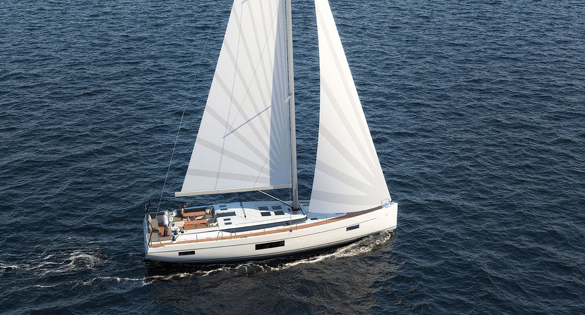 Lateral bird's eye view of a sailing boat on the deep blue water.